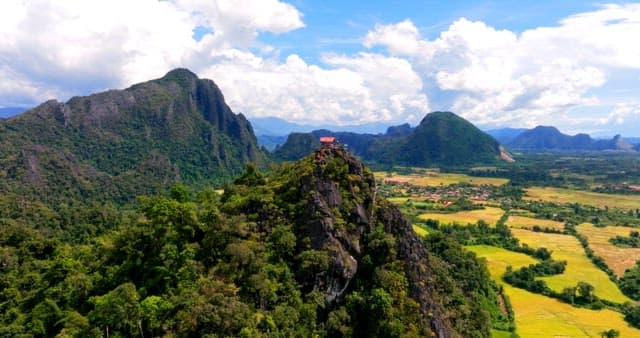 Scenic View of a Mountain Peak with a Hut