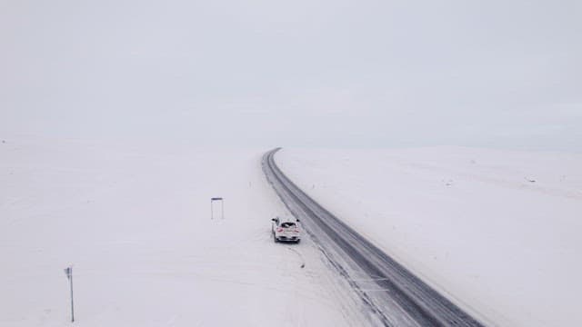 Car driving on a snowy road