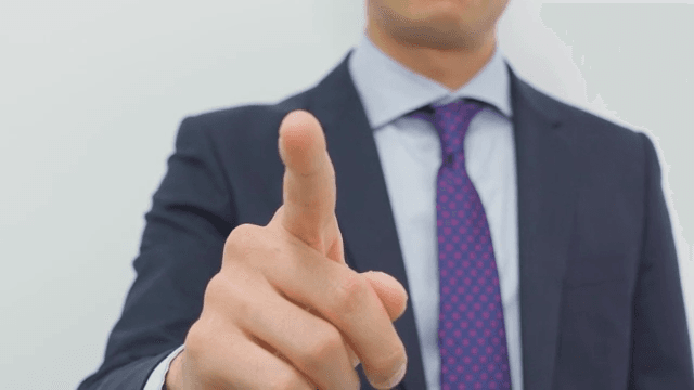 Business Professional Gesturing Confidence with Hand