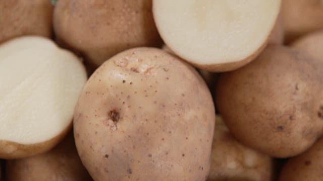 Cross Section of Fresh Potatoes Cut in Half