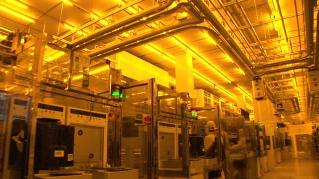 Technicians Working in a Semiconductor Facility