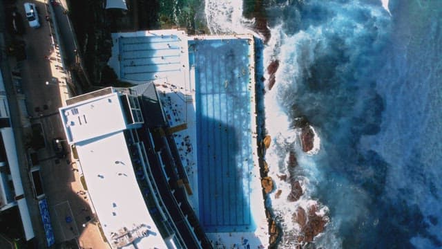 Seaside Pool Blending with Ocean Waves