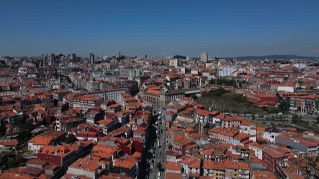 Historic Cityscape with Red Rooftops on a Clear Day