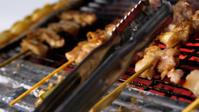 Grilled skewers sizzling deliciously on a red-hot grill