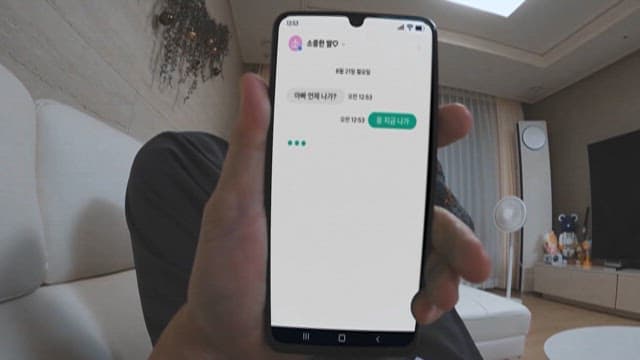Person holding smartphone with various screen displays