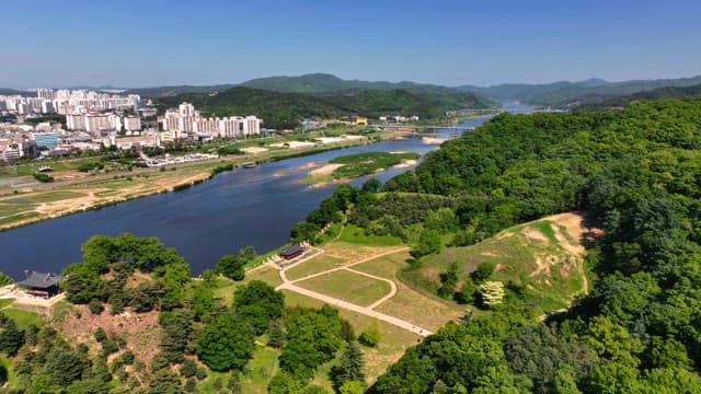 Tranquil river flowing through distant city