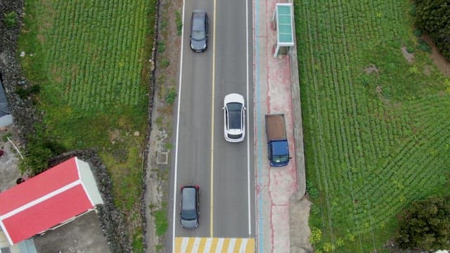 Cars driving on a rural road