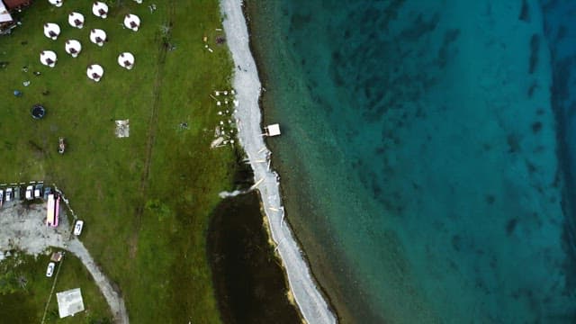 Serene lakeside with green fields