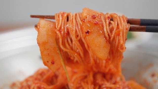 Chopstick of Red and Spicy Korean Melon Noodles