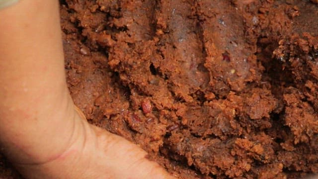 Hand mixing fermented soybean paste