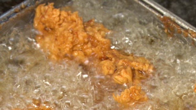 Chicken fried in hot, boiling oil to a golden brown color