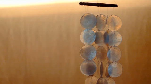 Shell Wind Chime Against Warm Sunset