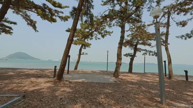 Serene beach with distant mountains