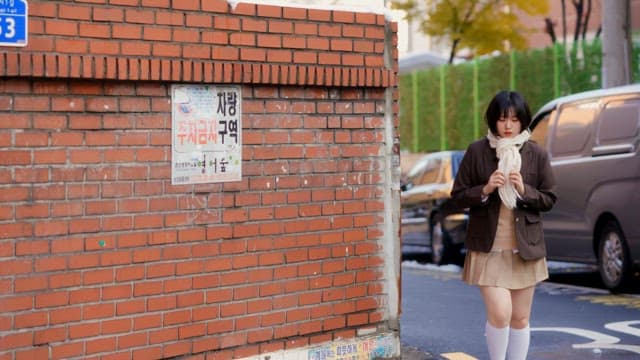 Student walking on the street in winter