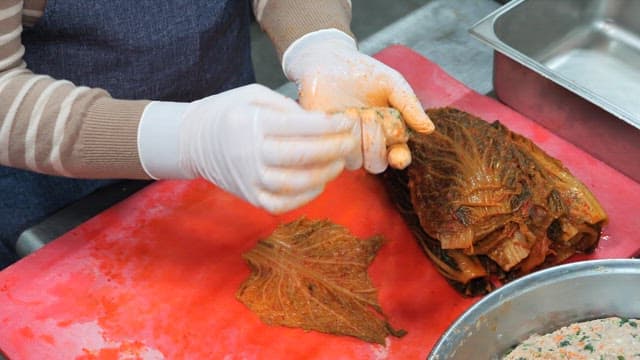 Preparing and Wrapping Meat with Kimchi into Rolls