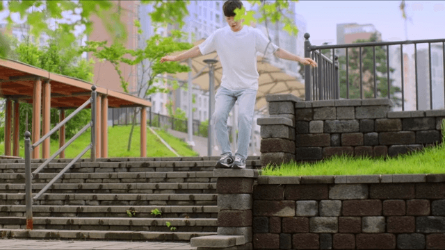 Man walking down steps in a city park