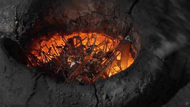 Metal pieces being heated in a furnace
