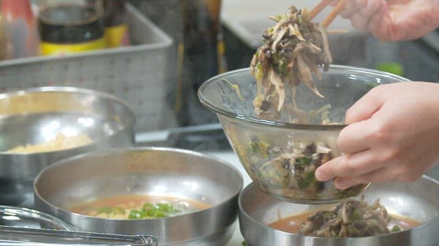 Preparing garnish of oyster mushroom in the kitchen