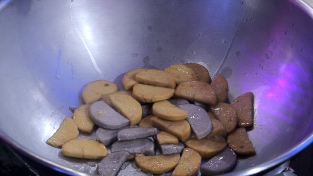 Sliced bread starter being cooked in a pan