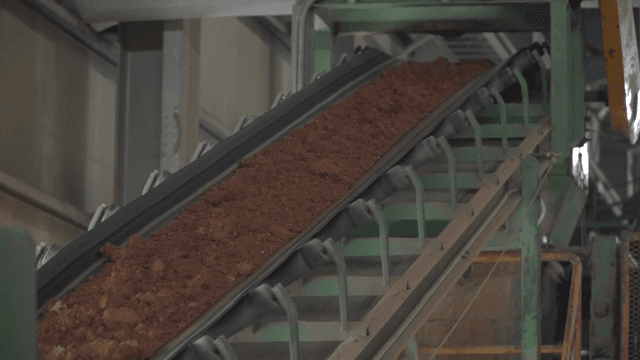 Conveyor belt transporting soil