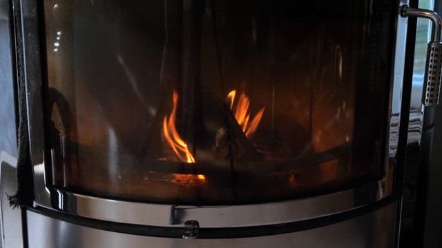 Fire burning in an indoor fireplace