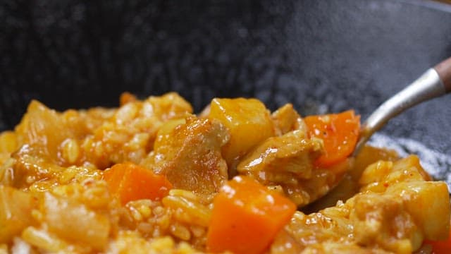 Spoonful of delicious curry with meat and vegetables