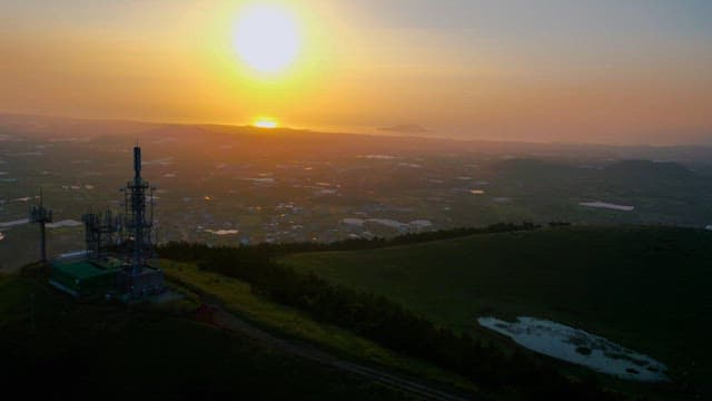 Sunset Over the Countryside with Communication Tower