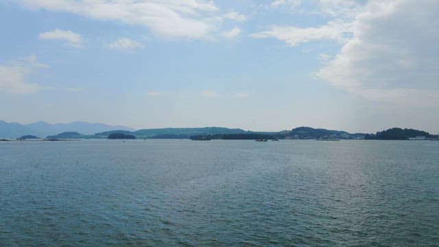 Calm sea with distant islands