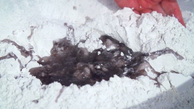 Mixing starch and water with both hands