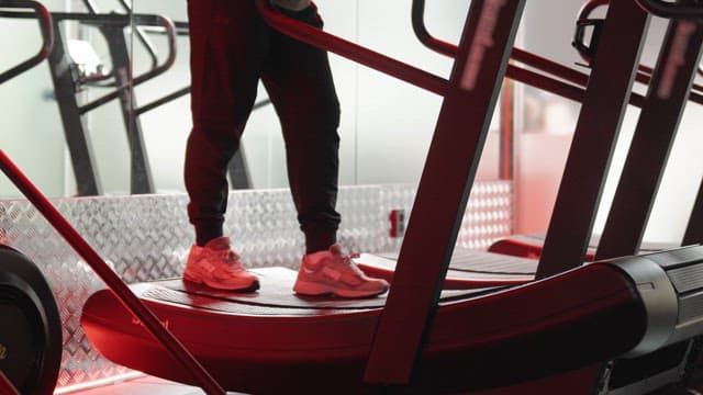 Person running on a treadmill indoors