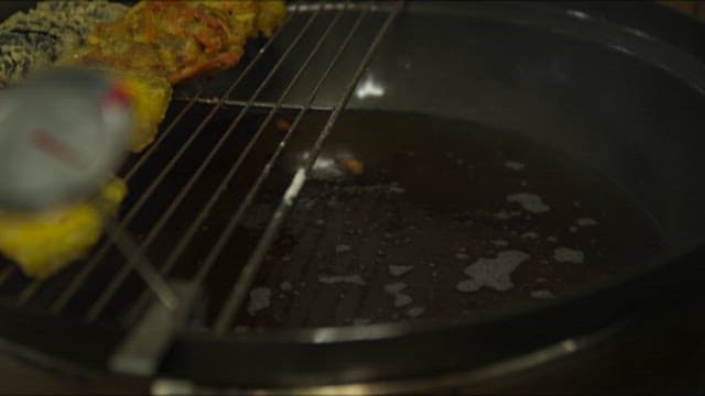 Flames Rising Above the Oil Being Heated for Cooking