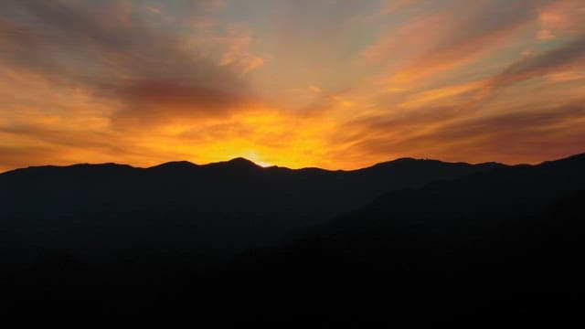 Majestic Sunrise over Mountainous Landscape