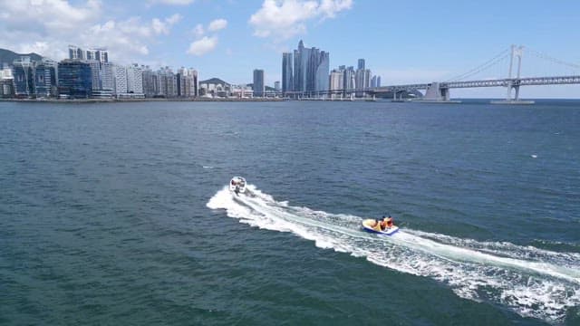 Water sports enjoyed on a sunny day near a coastal city