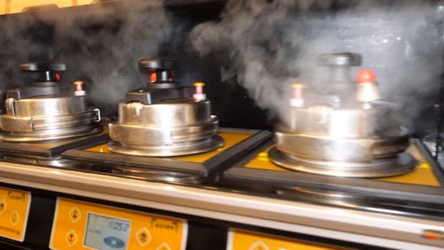 Steaming Pots in Restaurant Kitchen