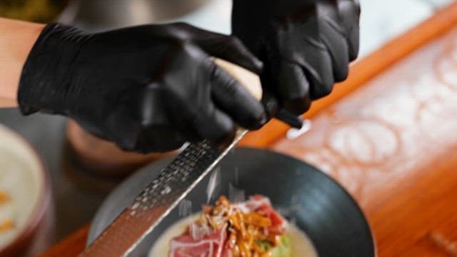 Cheese Grating on Noodles with Toppings