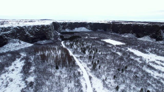 Snow-covered landscape with cliffs