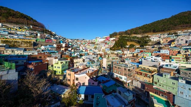 Day to night view of a Gamcheon Culture Village with colorful residential buildings
