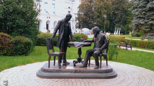 Statues of historical figures in a city park