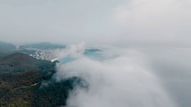 Mountains and coastal villages covered in thick fog