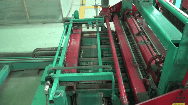 Machine processing brick in a factory