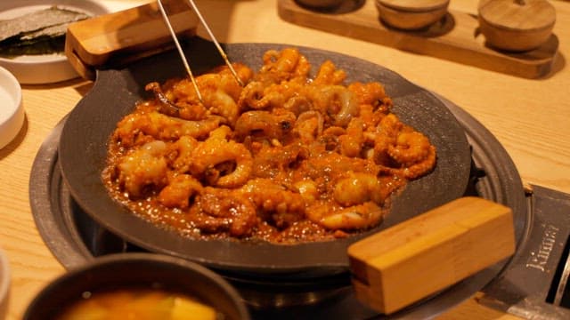 Stir the Stir-Fried Octopus to Prevent it from Sticking.