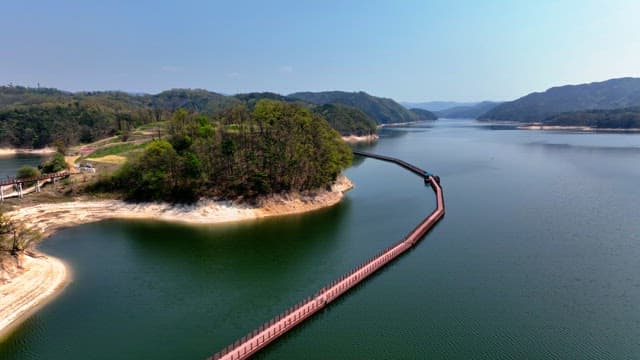 Scenic lake with a winding walkway