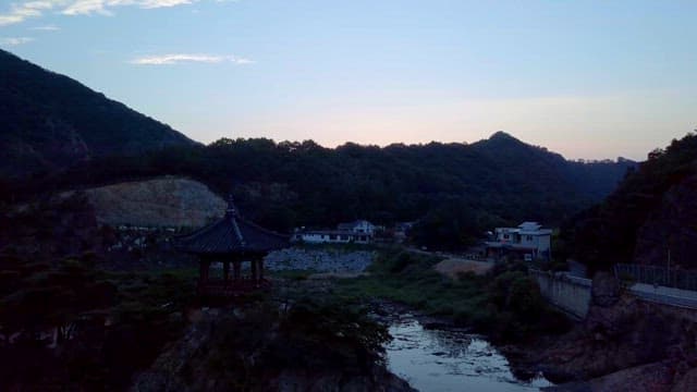 Riverside Scene in the Darkness at Dusk