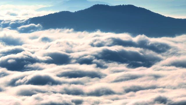 Mountain peaks above clouds