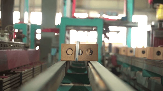 Conveyor belt in a factory with bricks