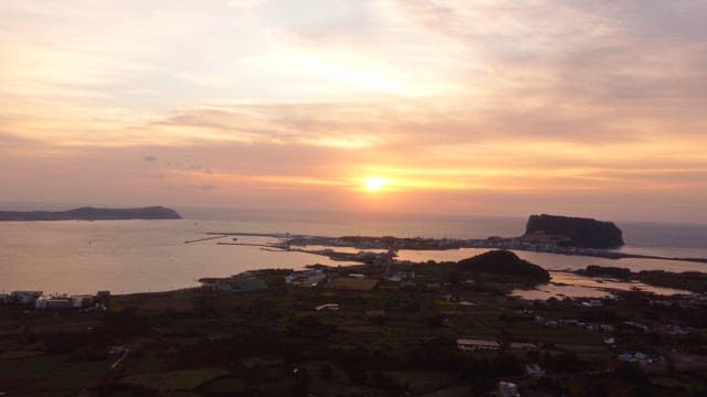 Sunset over a coastal village and sea