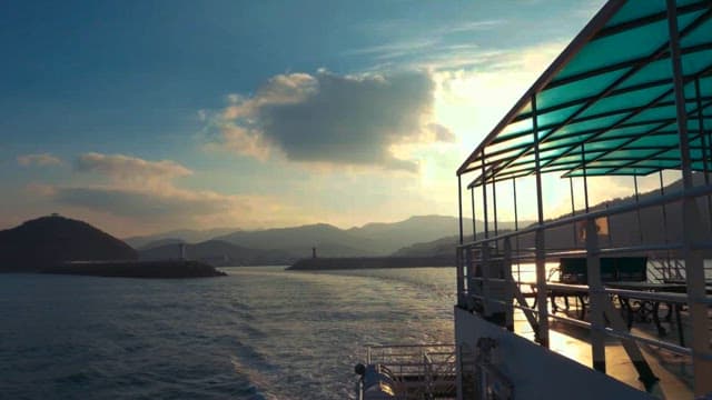 Boat Crossing the Water at Sunset