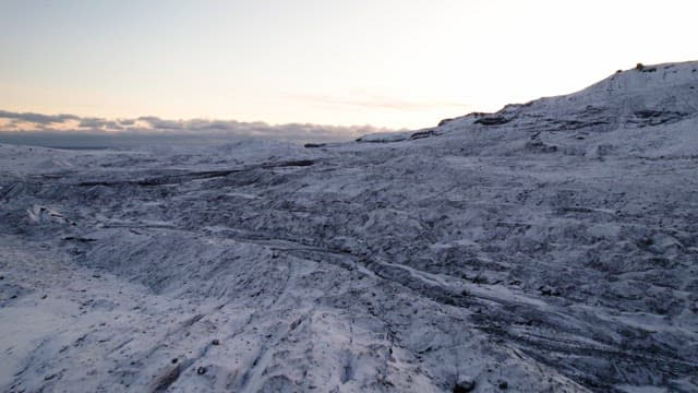 Vast glacier with snowy mountains