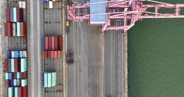 Cargo containers and ship at a port