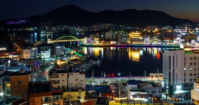 Colorful night view of a busy port city
